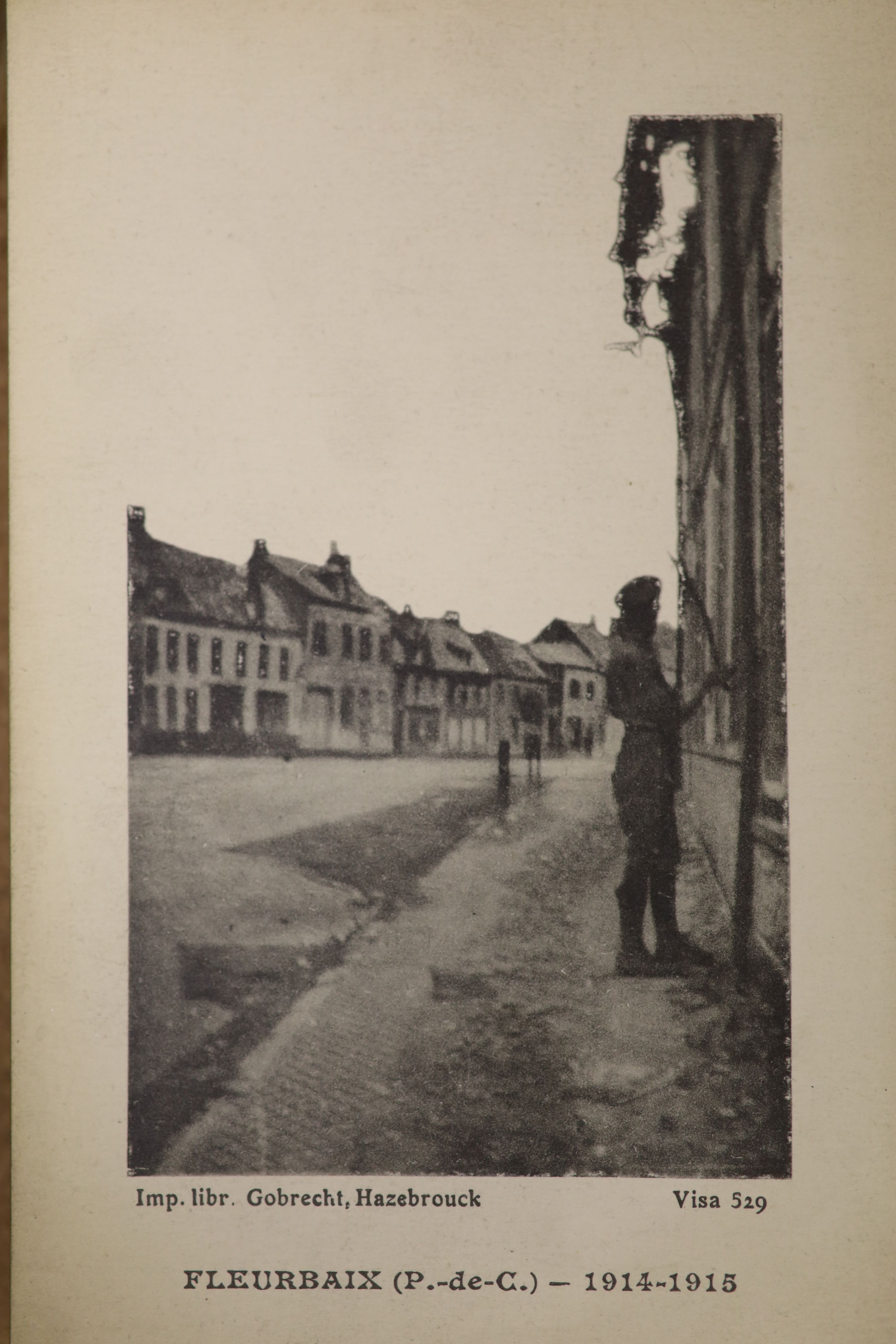 Three albums of photographs and a quantity of postcards inc. erotica.